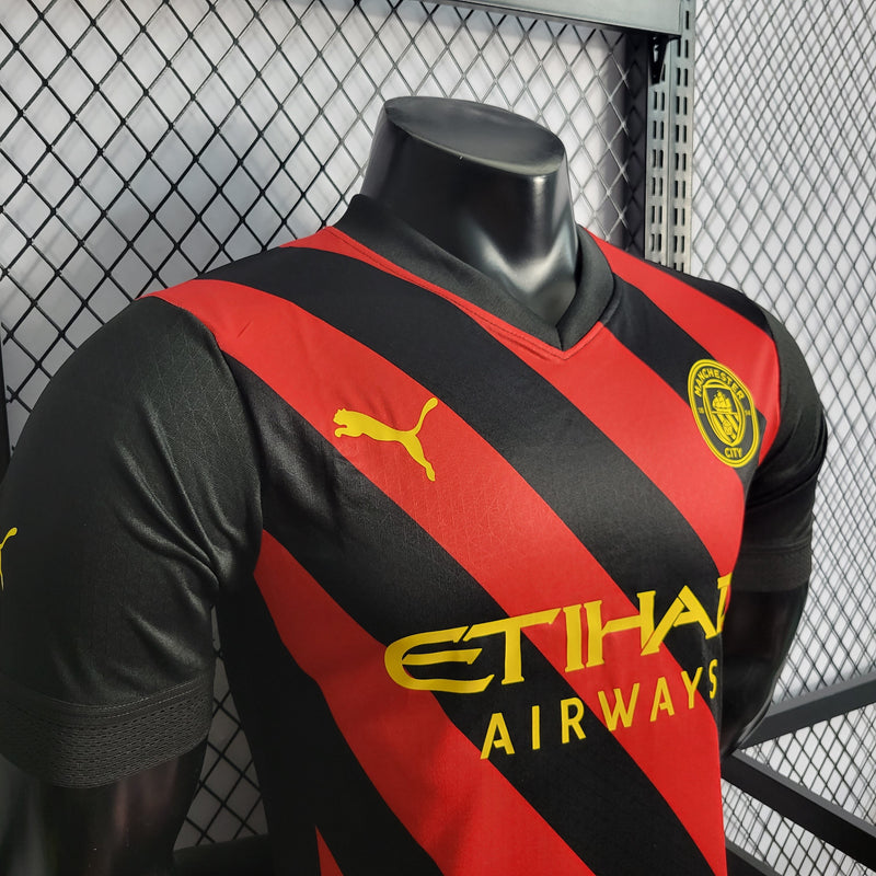 CAMISA VERSÃO PLAYER DO MANCHESTER CITY 22/23 VERMELHO E PRETO - VELOP SPORTS